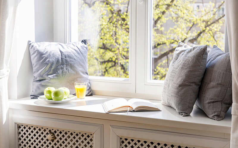 Window sill with pillows and food